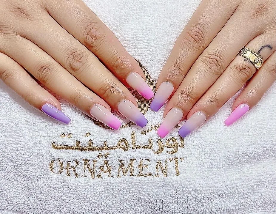 Purple and pink ombré nails on an Ornament towel