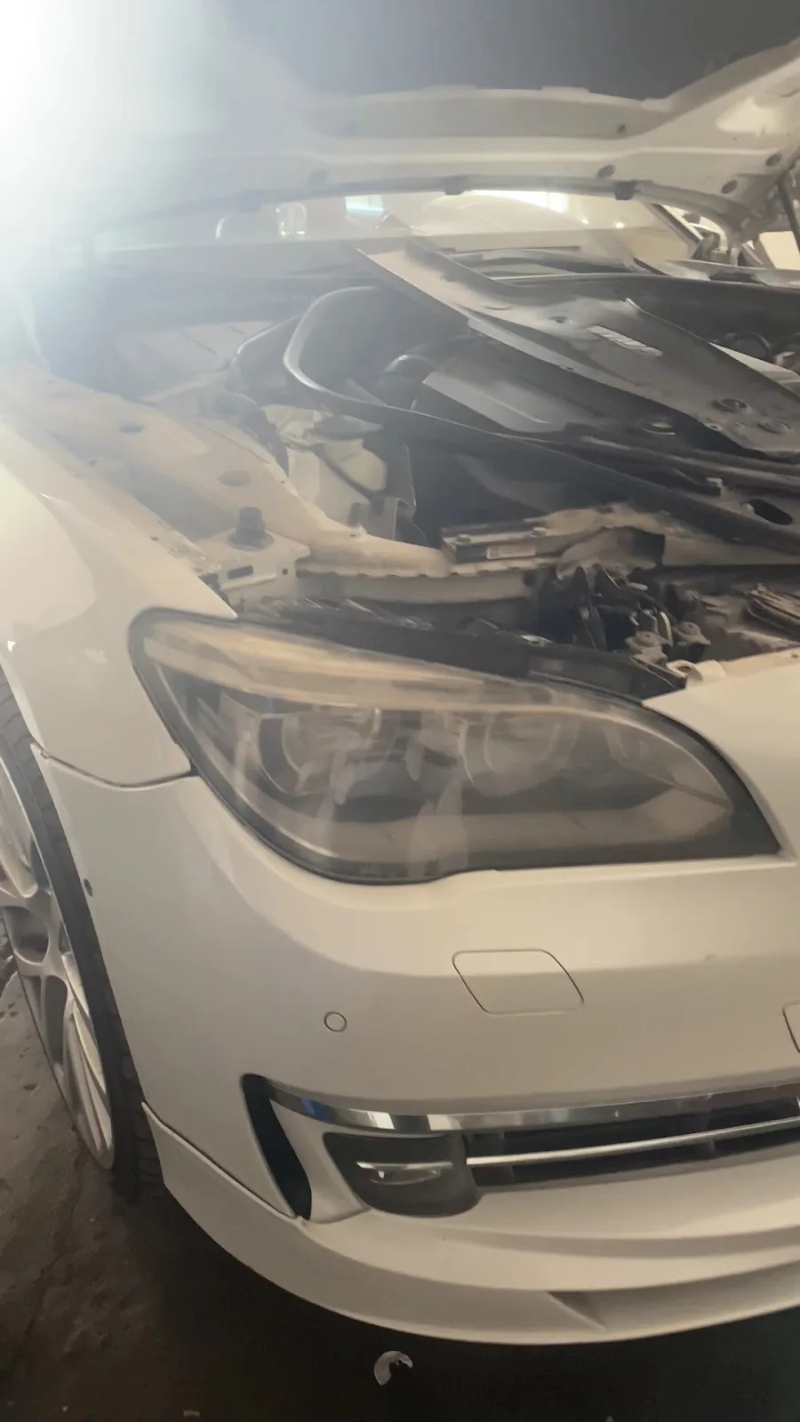 A pneumatic air suspension strut removed for diagnosis and replacement
