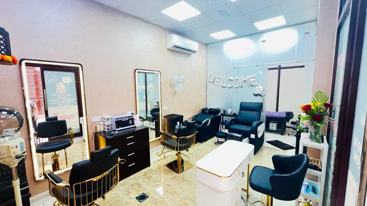 Inside StyleLab Beauty Salon — styling chairs and pedicure lounge with a Welcome display