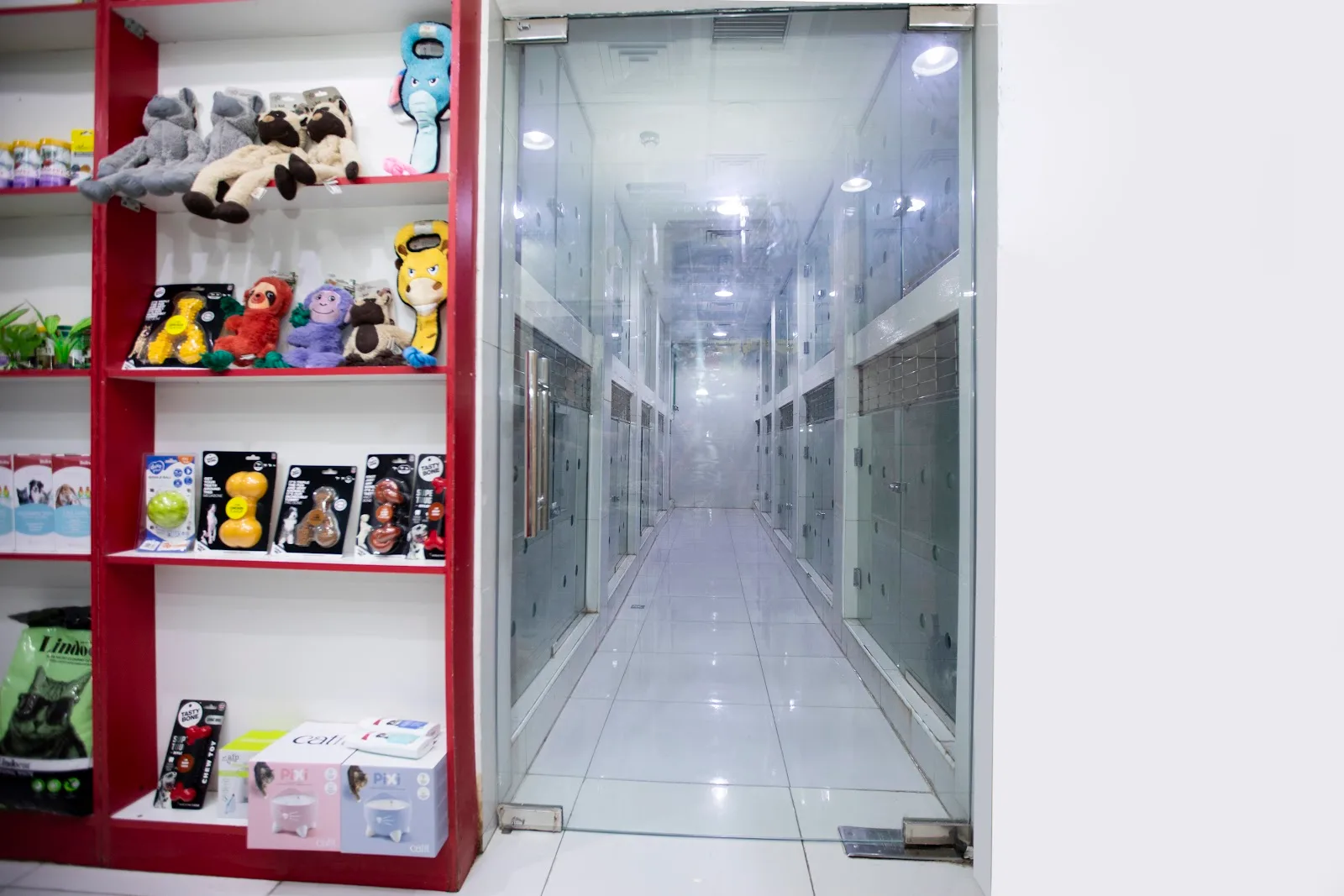 Pet shop shelves stocked with toys, treats and supplies at Petlove