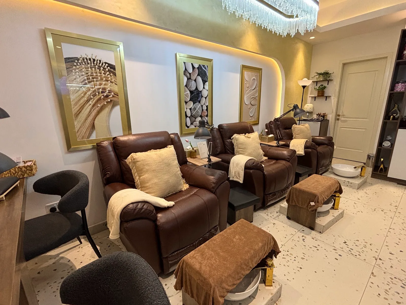 Row of leather recliner chairs in the pedicure and treatment lounge