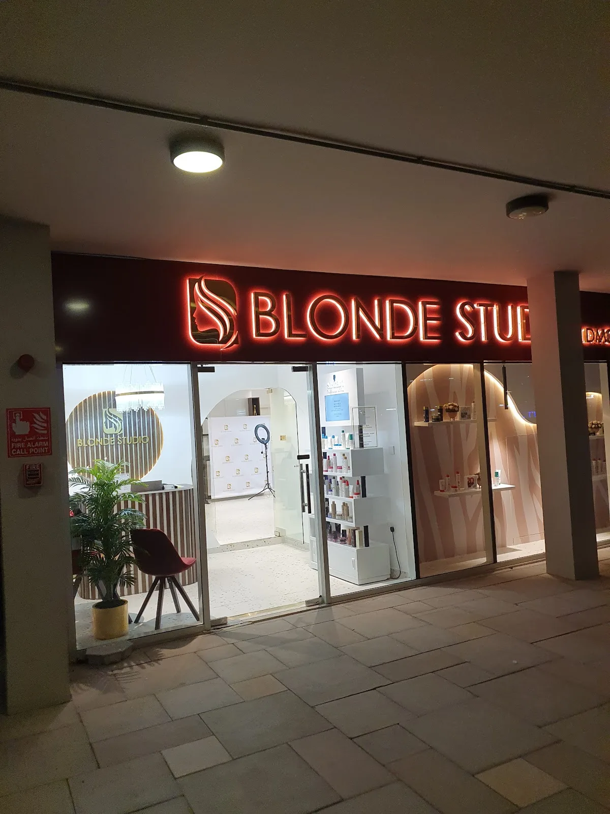 Blonde Studio storefront with illuminated red signage at Dubai Star