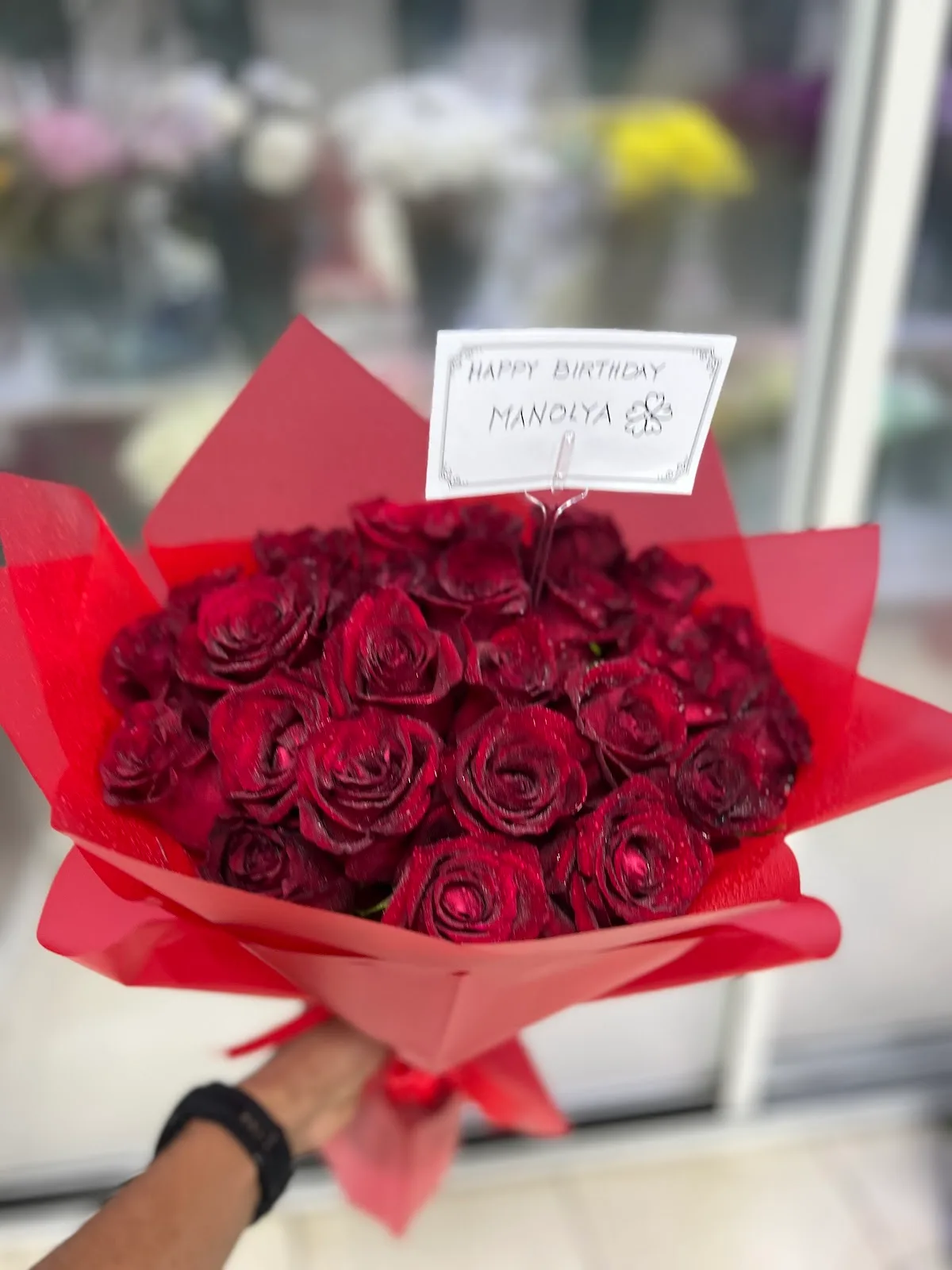 Bouquet of red roses wrapped for a birthday