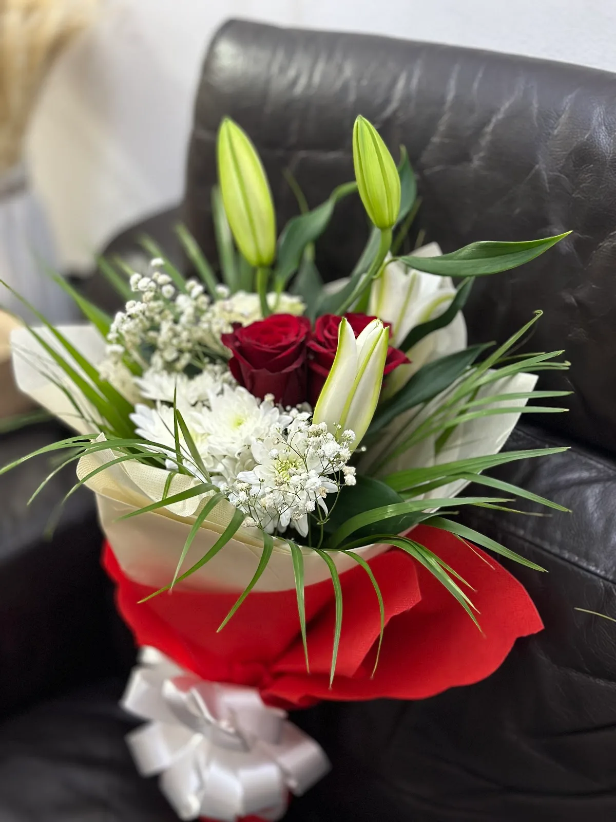 Red roses and white lilies bouquet