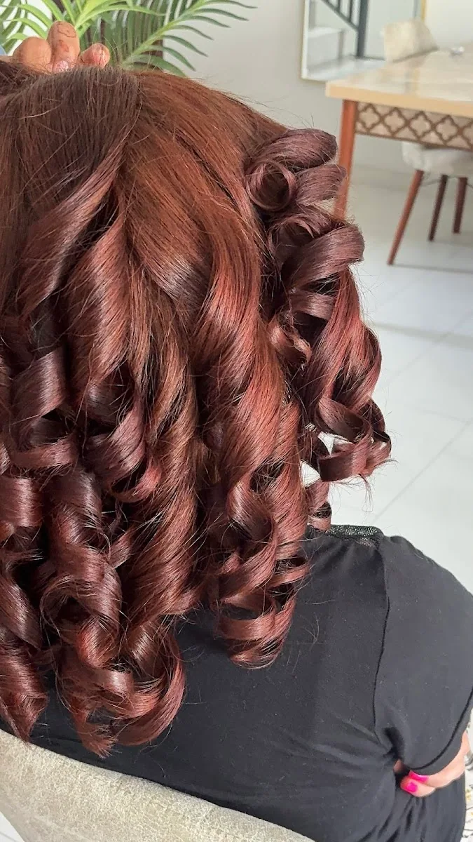 Glossy auburn ringlet styling at Silky Touch Ladies Salon