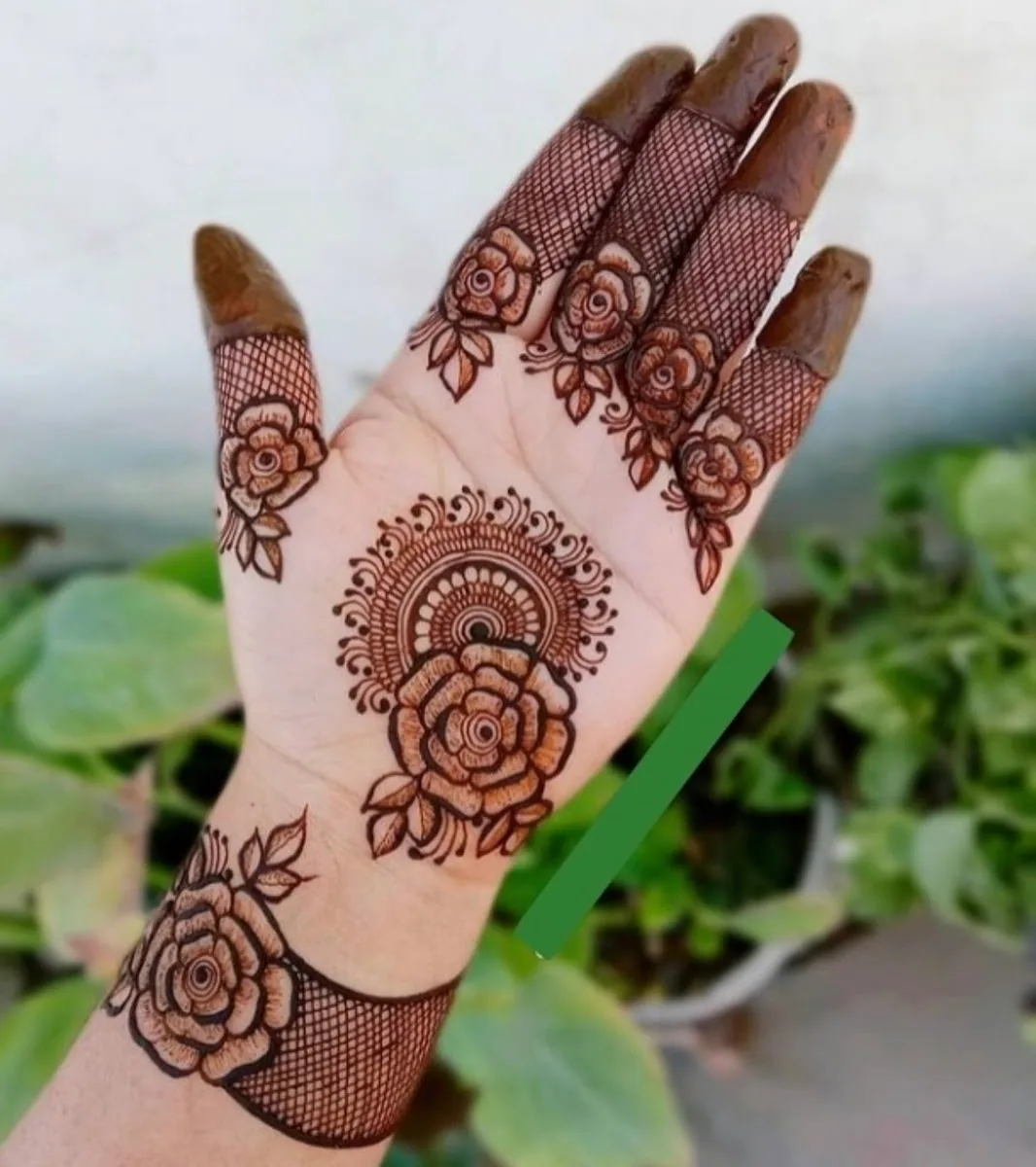 Rose mehndi design on the palm