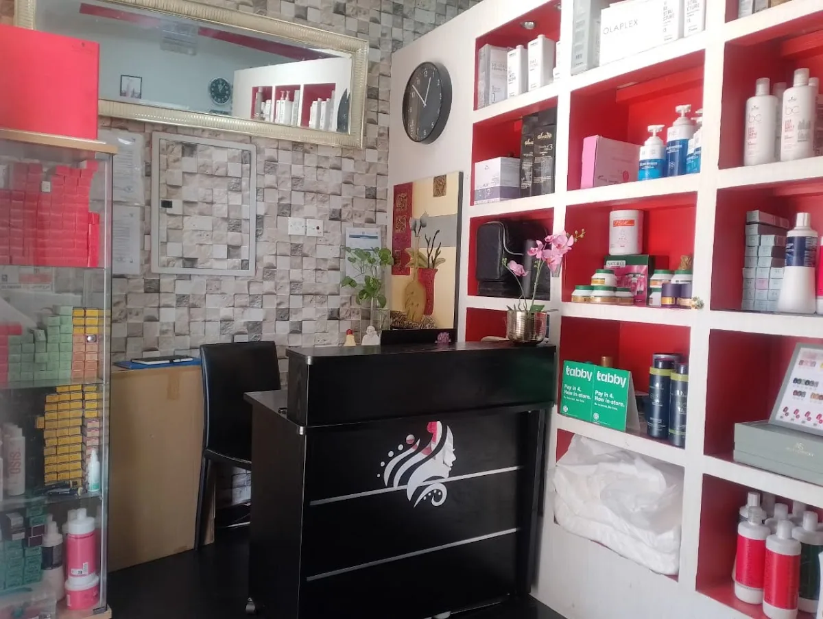 Inside Silky Touch Ladies Salon — styling station and product wall