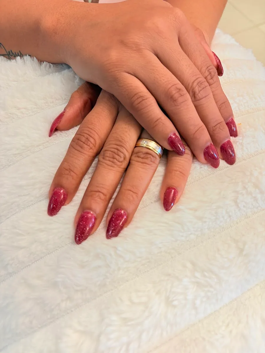 Burgundy shimmer almond nail finish