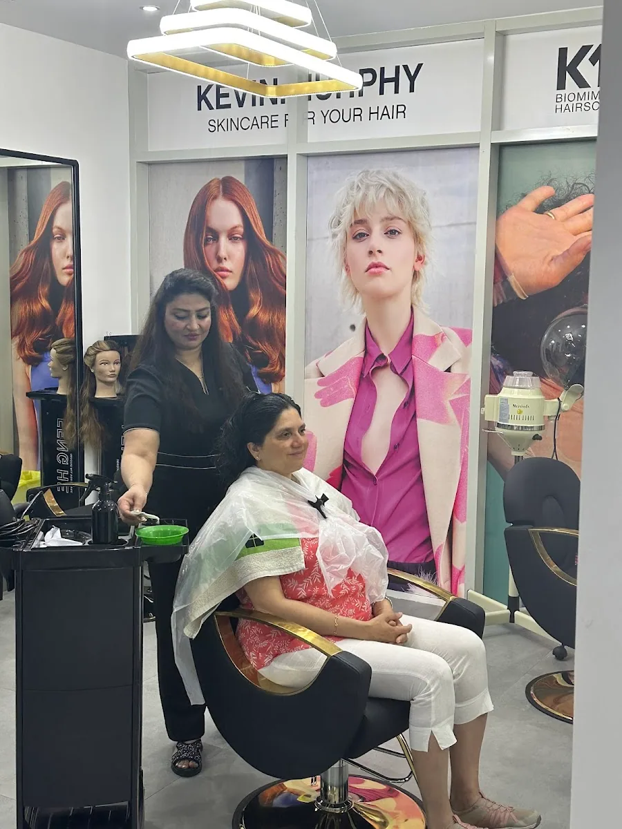 Stylist colouring a guest's hair