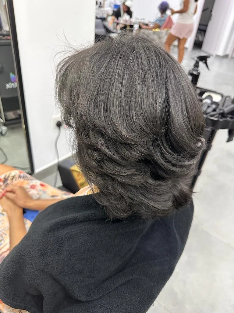 Glossy dark wavy blow-dry