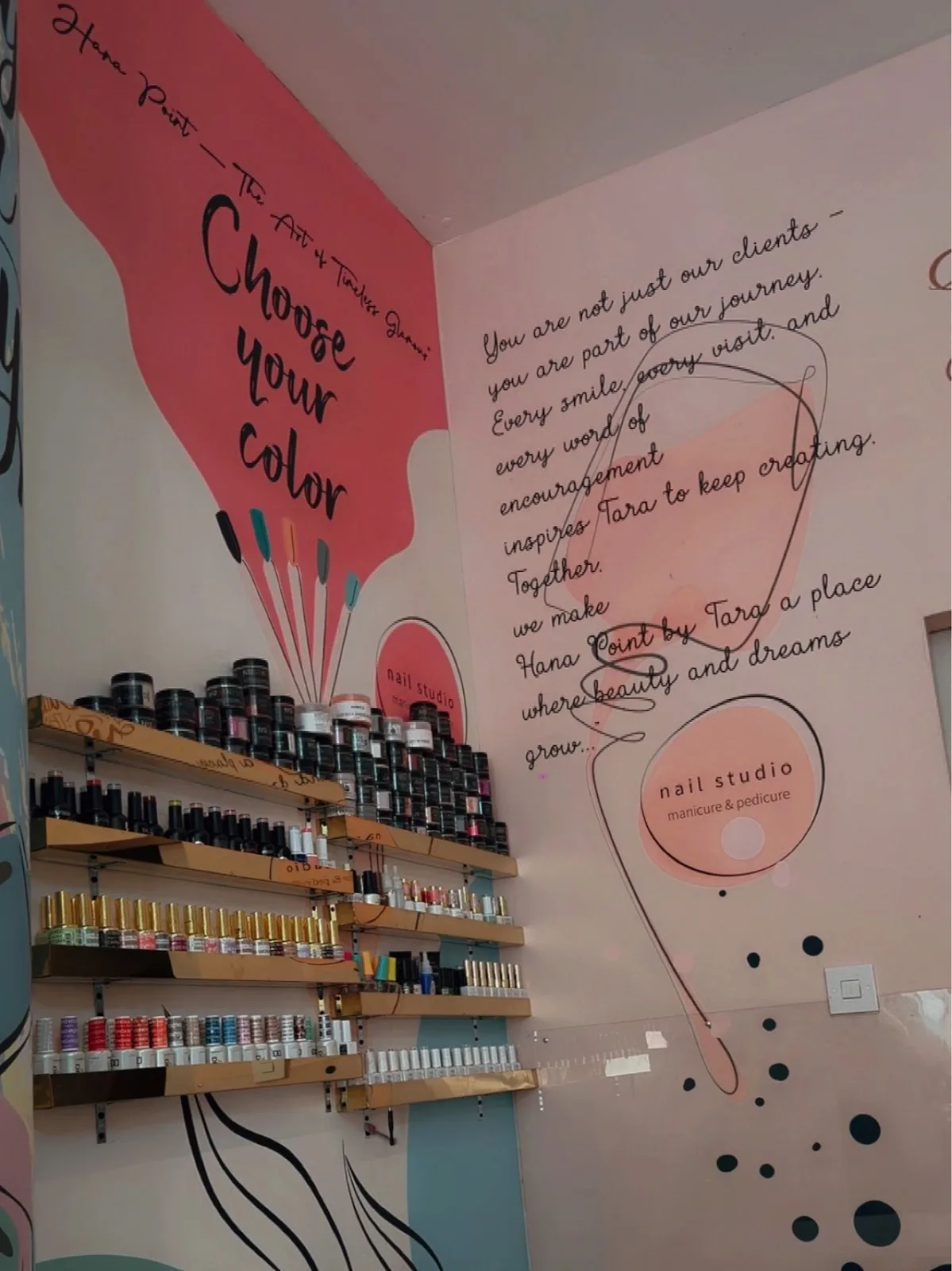 Hand-lettered wall inside Hana Point reading Choose your colour, by Tara