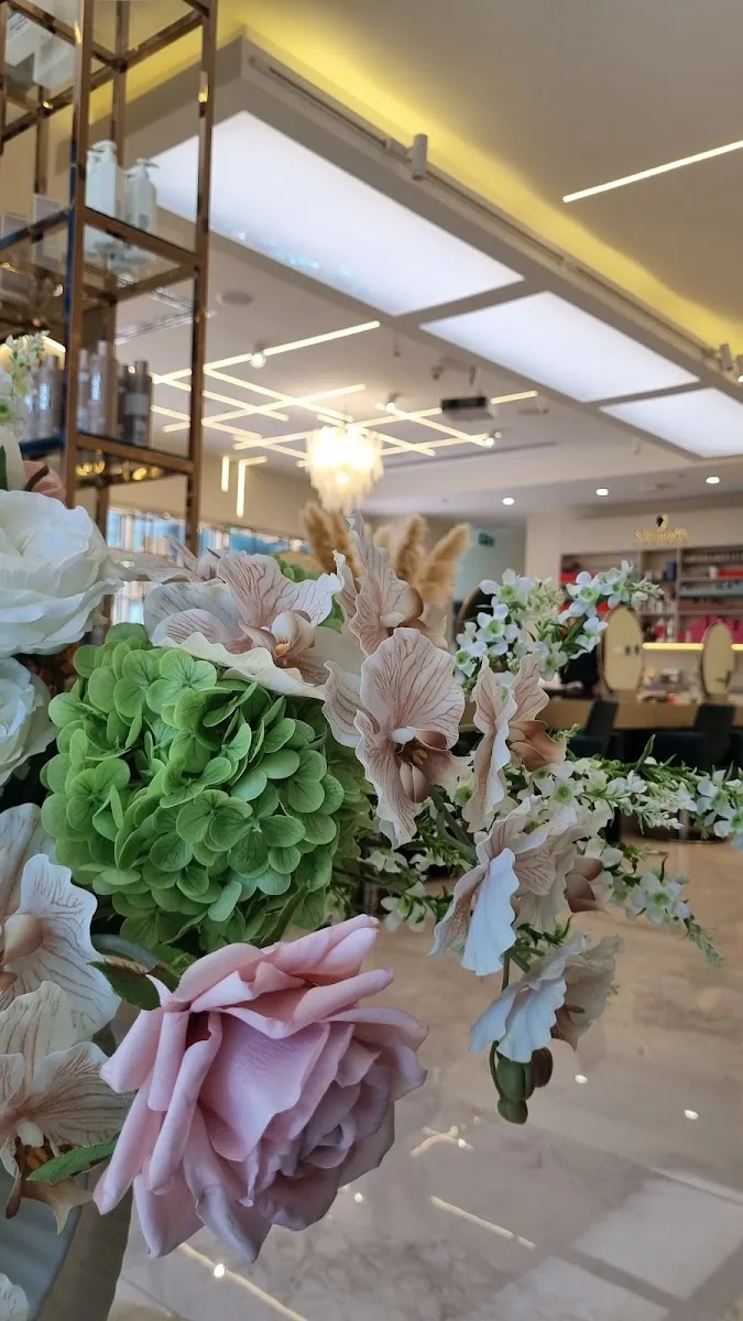 Soft mauve and green floral arrangement in the salon