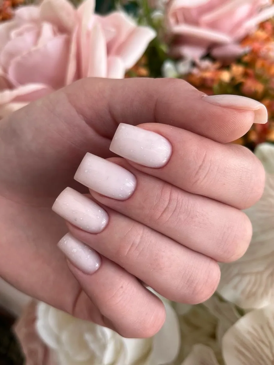 Soft natural manicure with shimmer finish at JM Beauty Salon