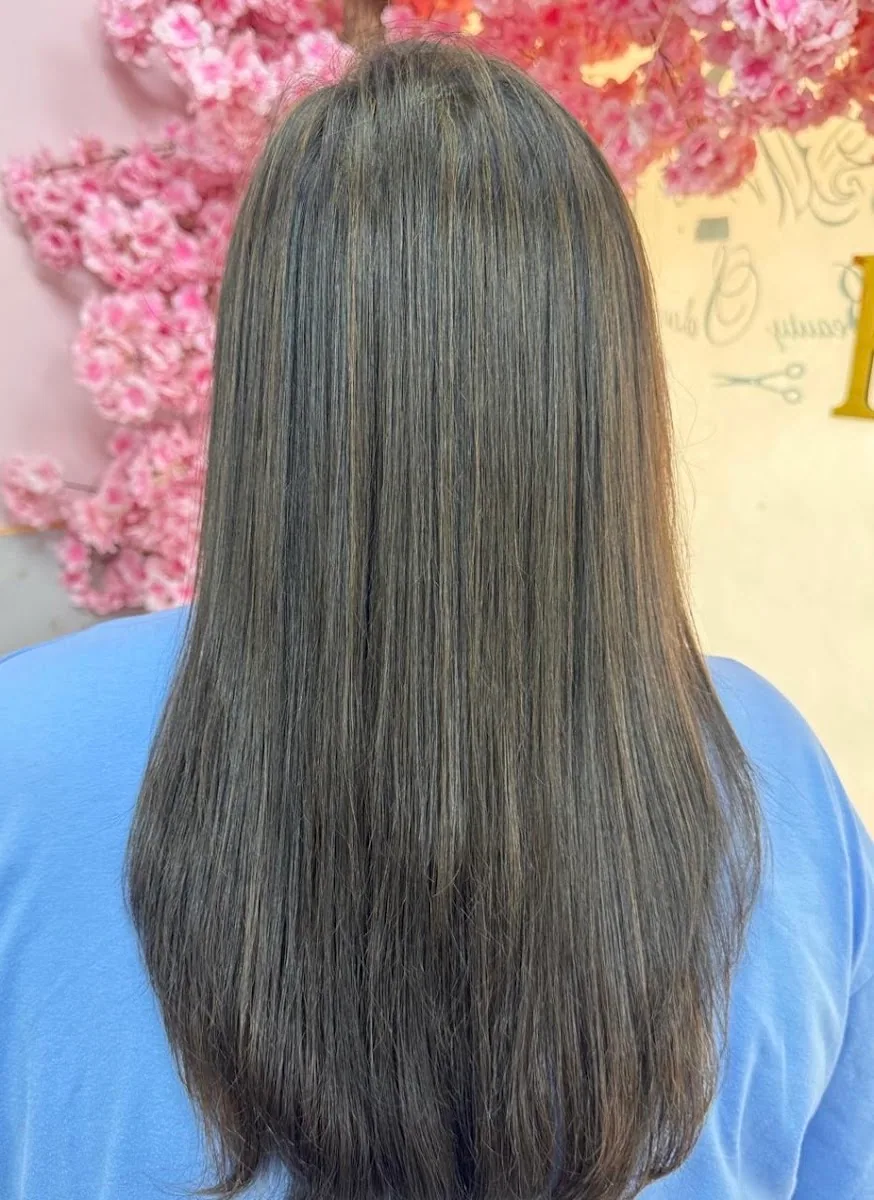 Long, glossy blow-dried hair styled at RC Salon