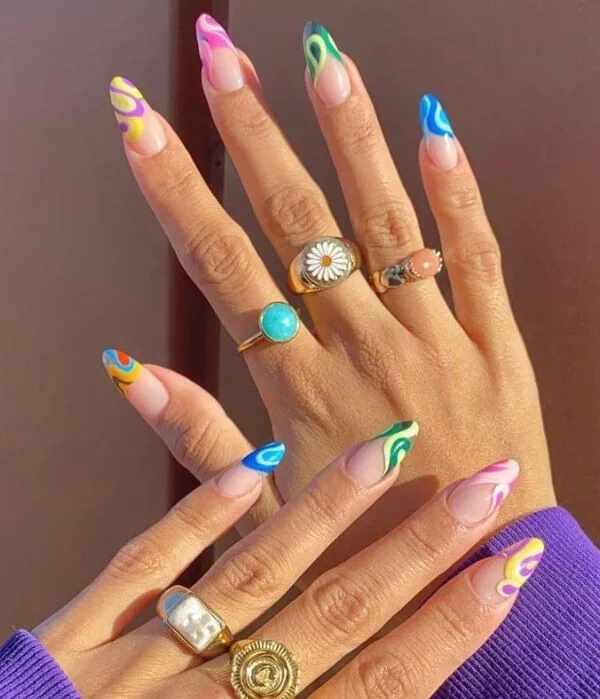 Colorful hand-painted nail art at RC Salon