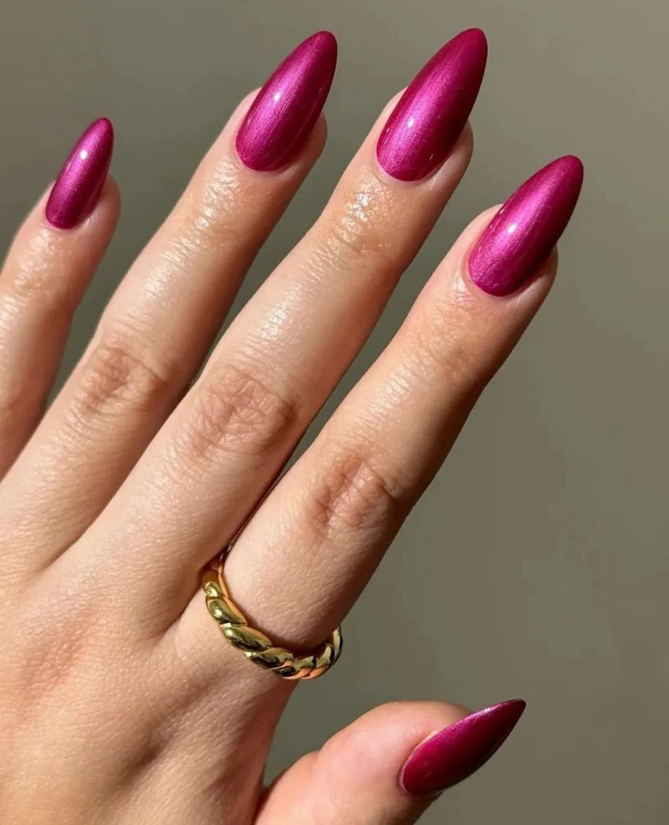 Almond nails in a rich magenta chrome finish