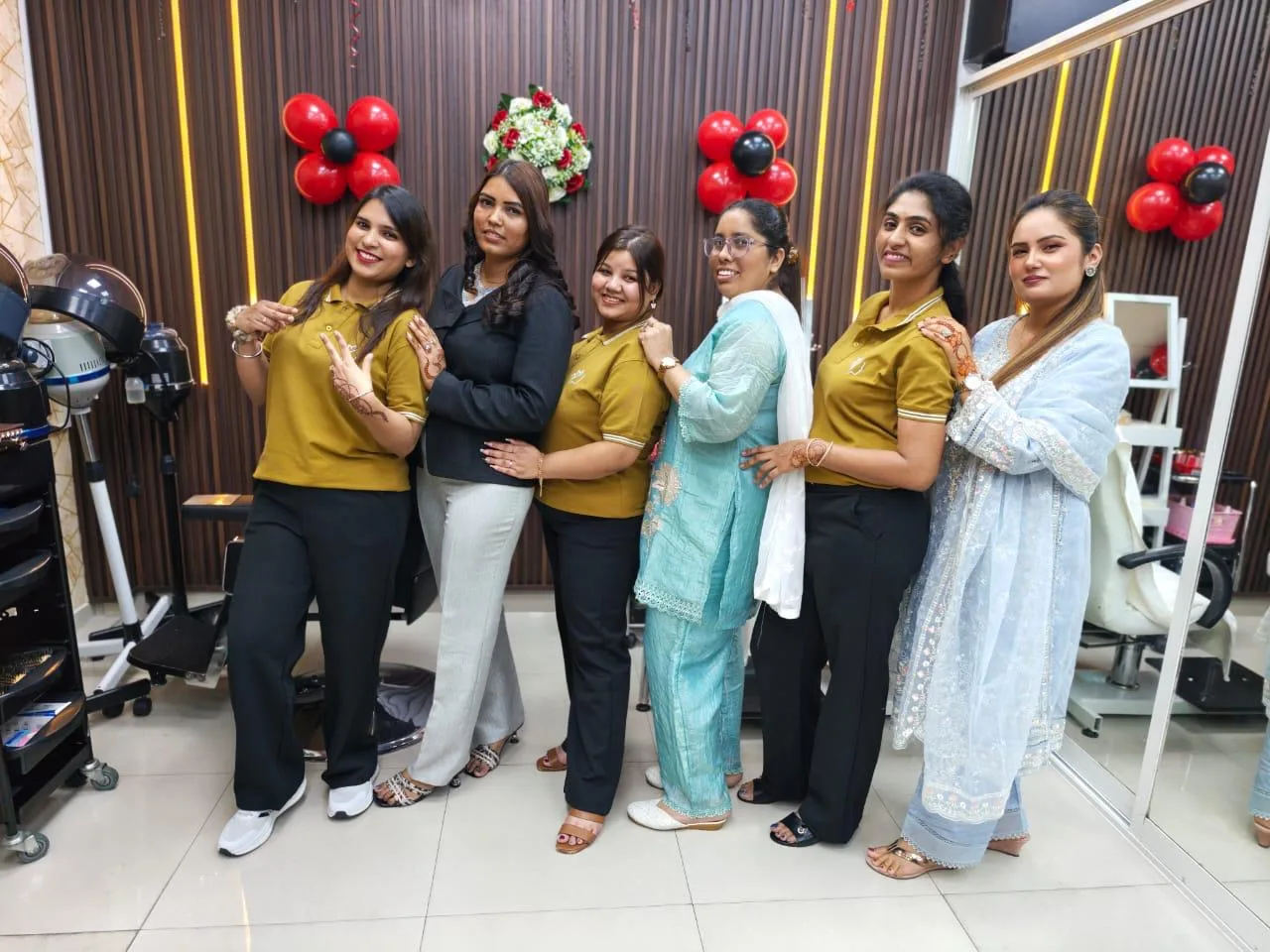 The Elegant Essence Beauty Salon team together at the salon