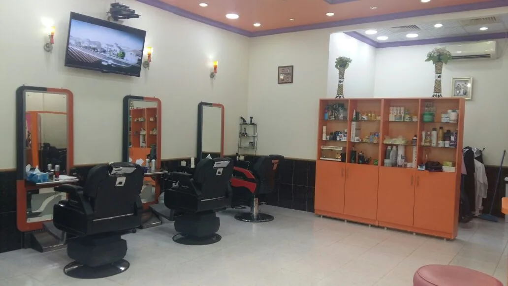 Interior of the Miss Caramel studio with styling chairs and mirror stations