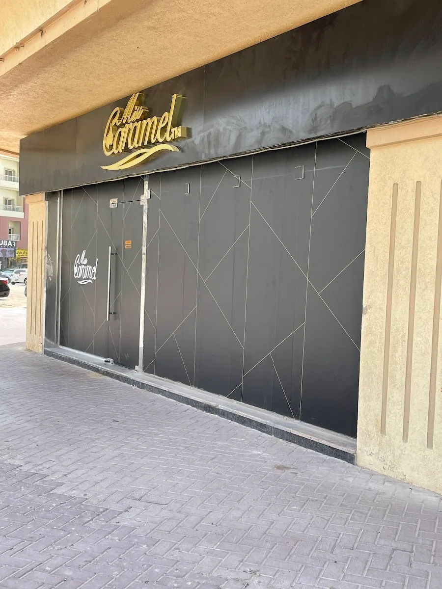 Miss Caramel storefront by day with gold signage