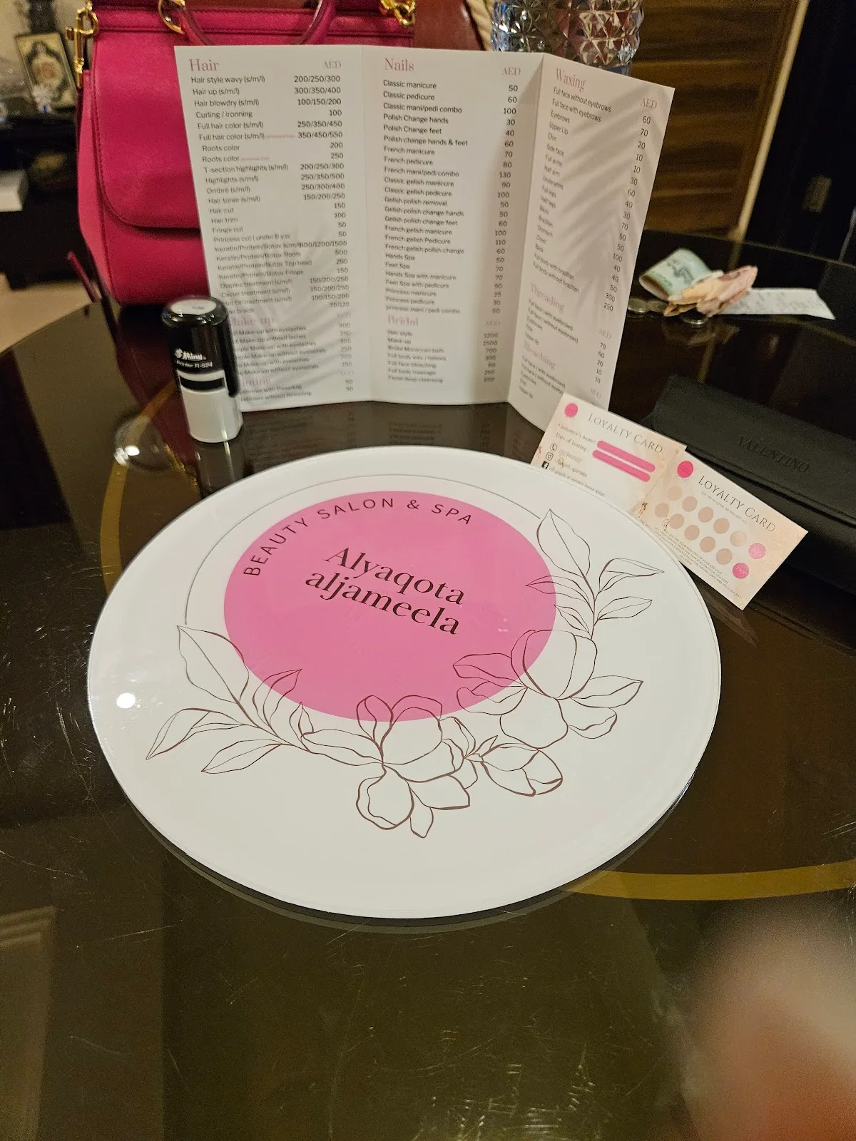 Al Yaqota Aljameela printed service menu and loyalty card