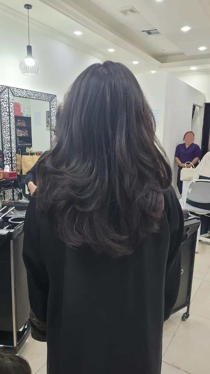 Layered, glossy blow-dry styled at Al Yaqota Aljameela salon in Al Warqa, Dubai