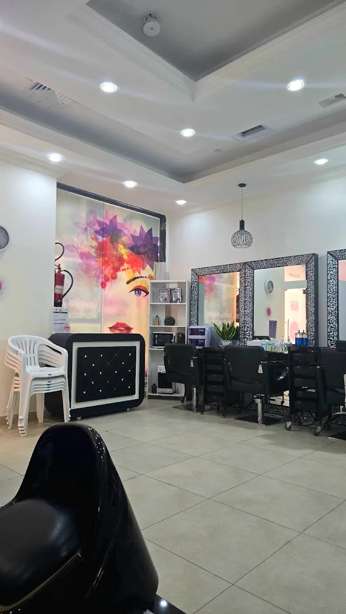 Bright interior of Al Yaqota Aljameela salon with styling mirrors