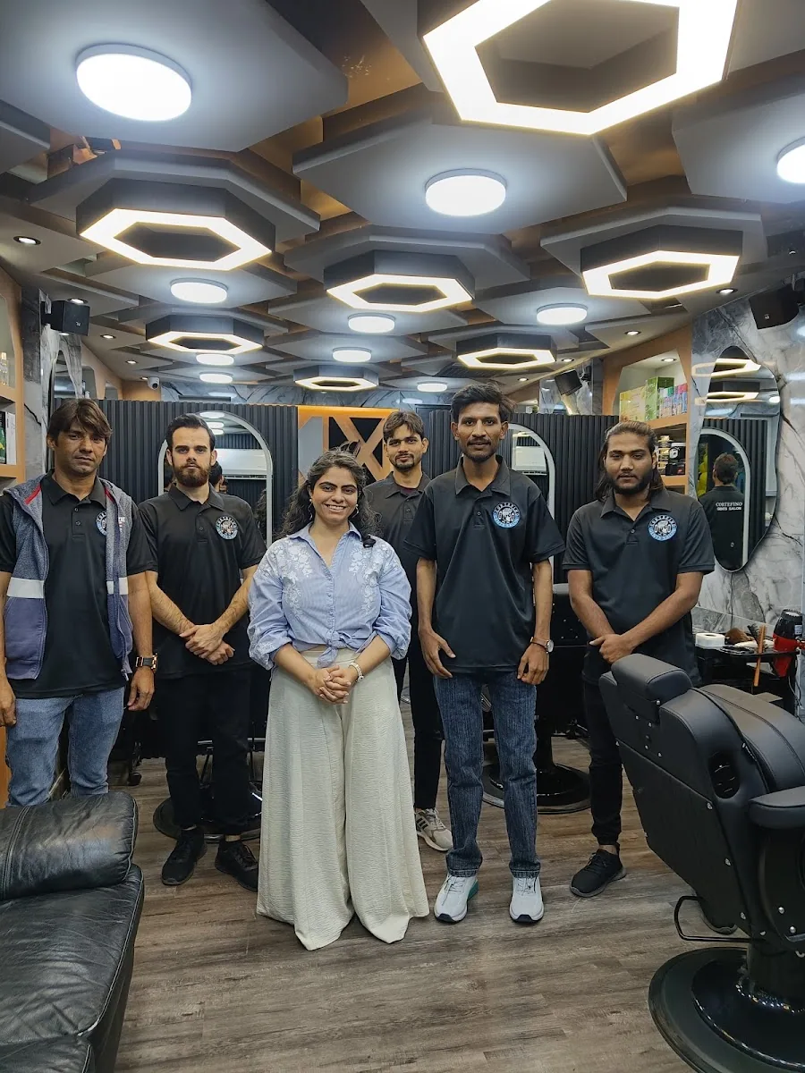 The CorteFino Gents Salon team standing together inside the salon