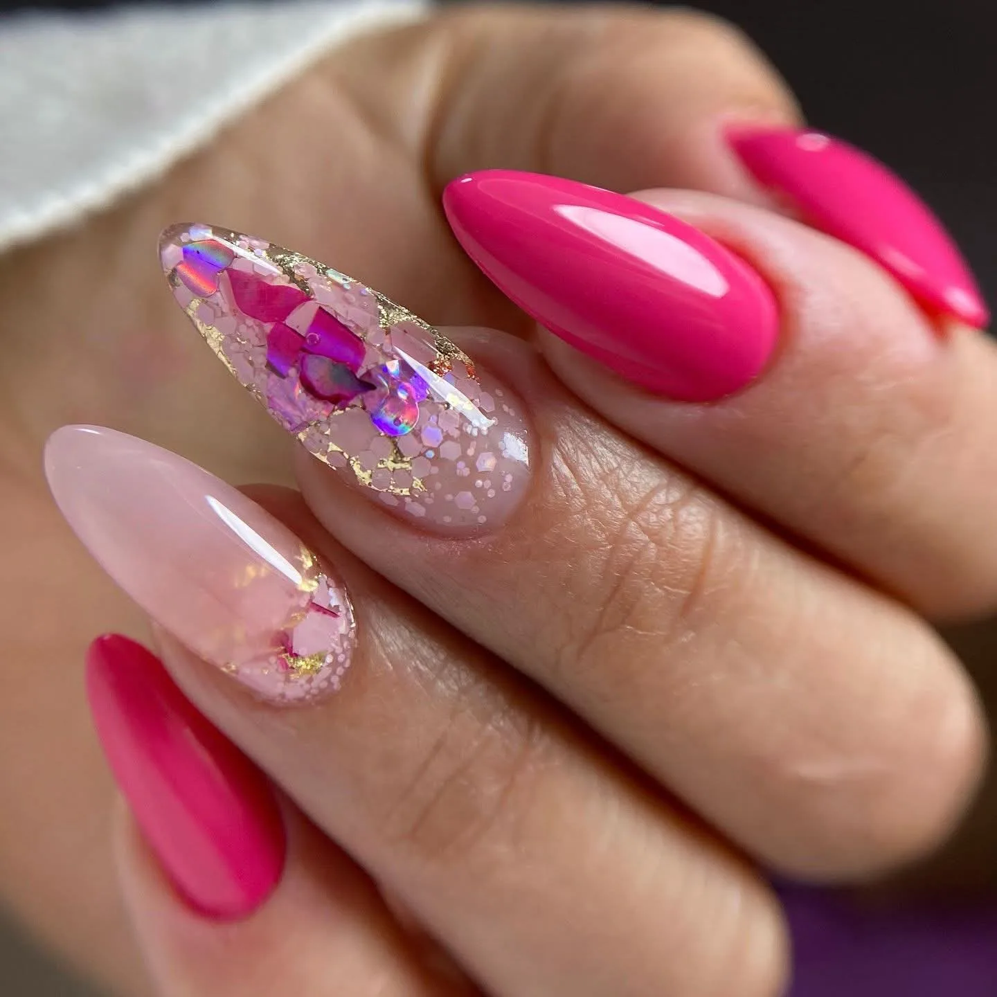 Glossy nude nails finished with pale-pink 3D bow accents
