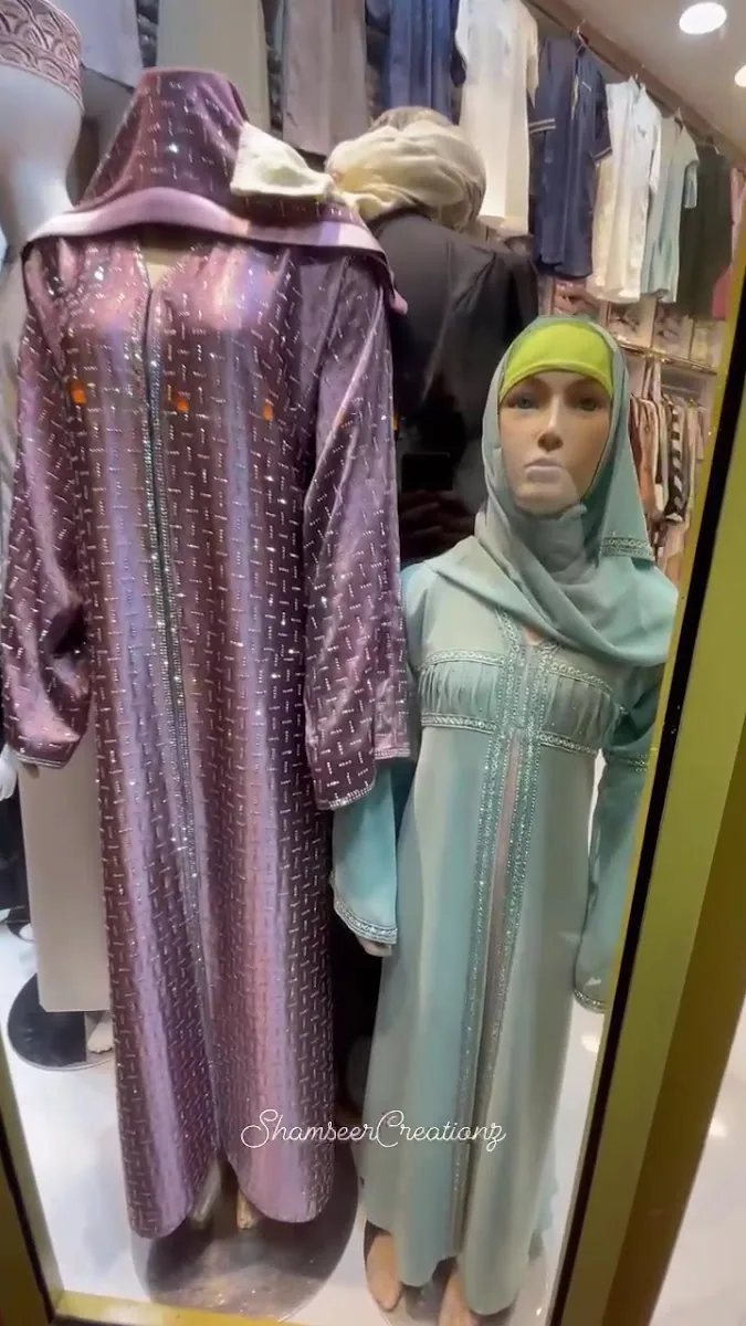 Shimmer occasion abaya beside a sage embellished abaya