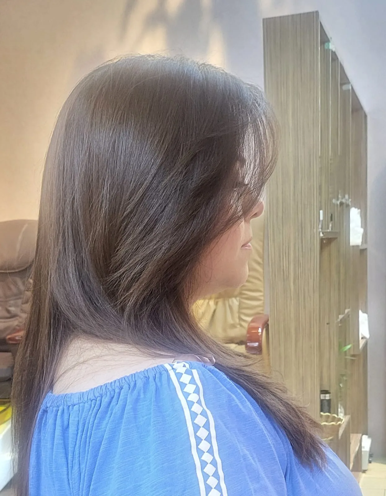 Glossy layered blow-dry styled at D Meraki Beauty Lounge