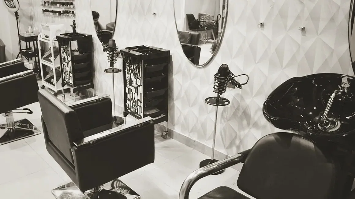Styling chairs, mirrors and wash station inside D Meraki Beauty Lounge