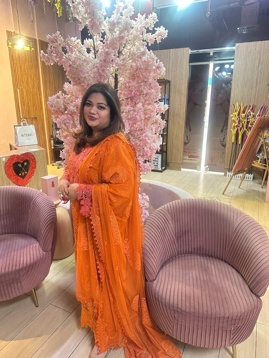 Guest at D Meraki Beauty Lounge seated by the salon's cherry-blossom lounge corner in Oud Metha, Dubai
