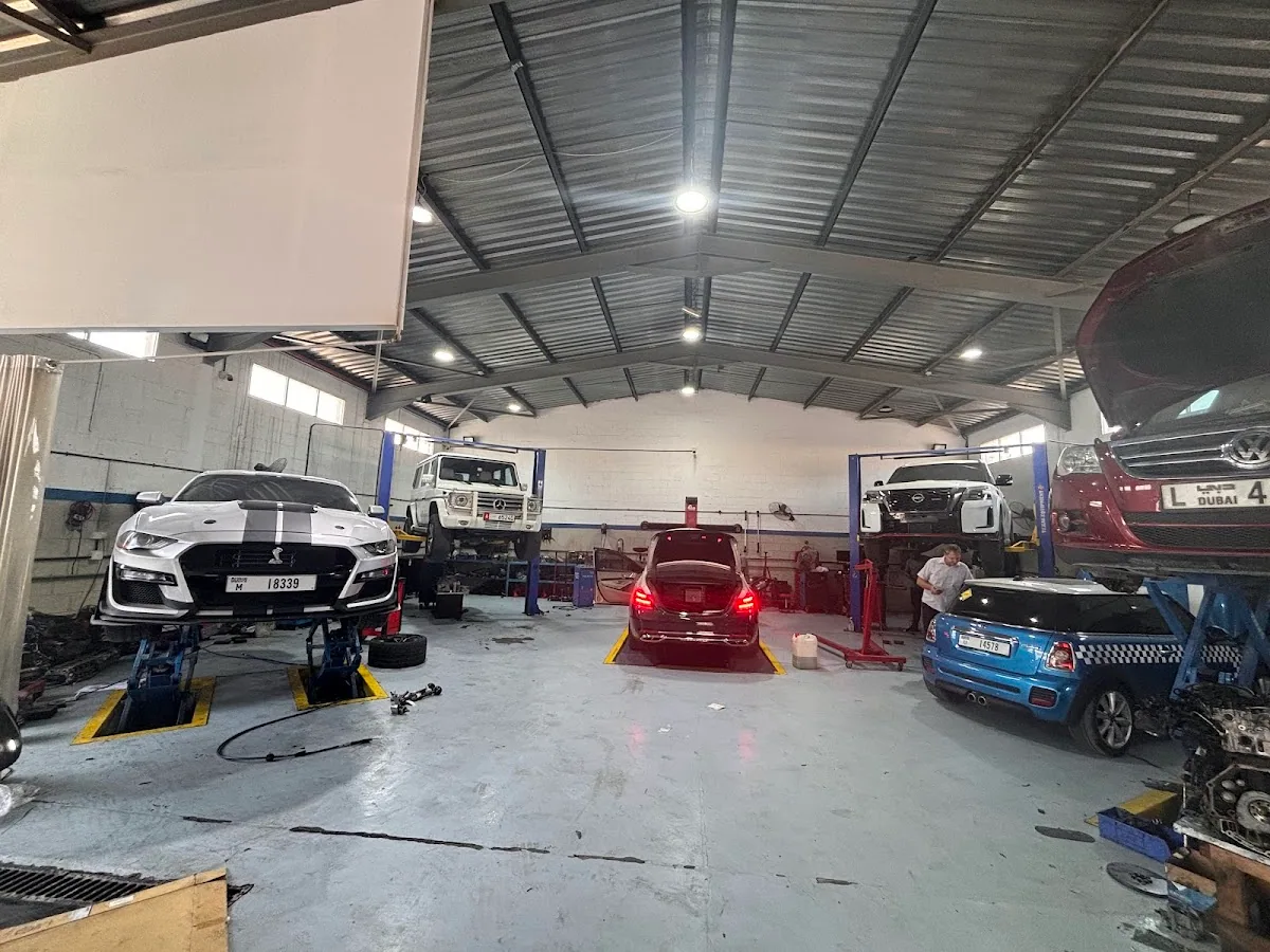 Cars raised on lifts across the Auto Craft Garage workshop floor