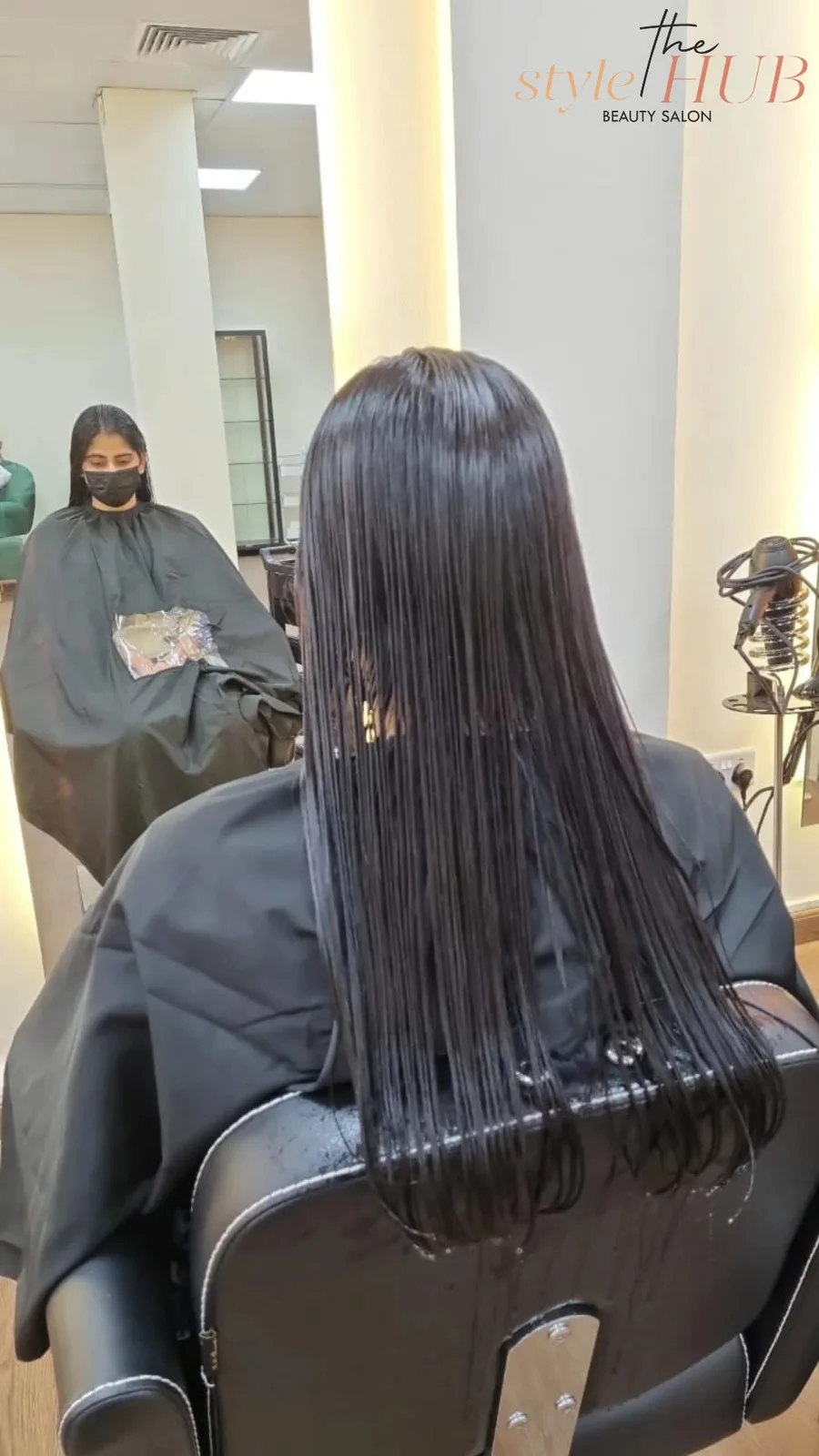 A guest having a hair treatment applied at The Style Hub