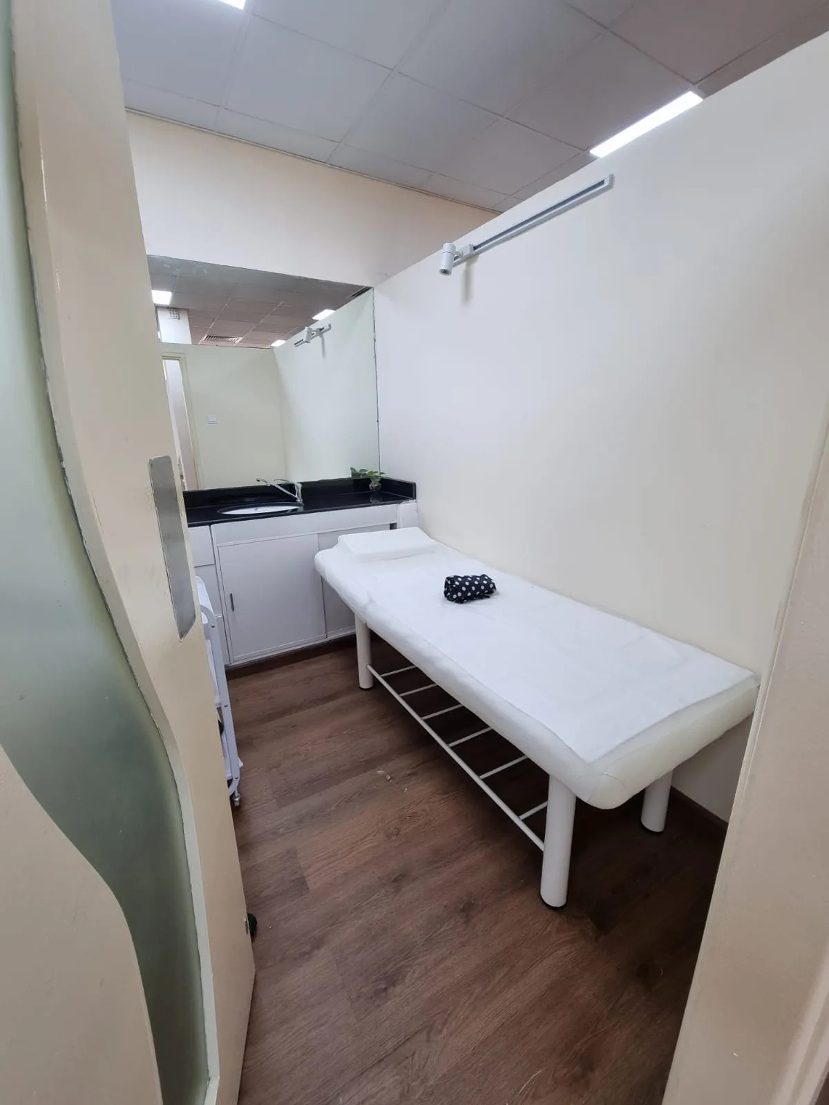 Private treatment room with a beauty bed at the salon