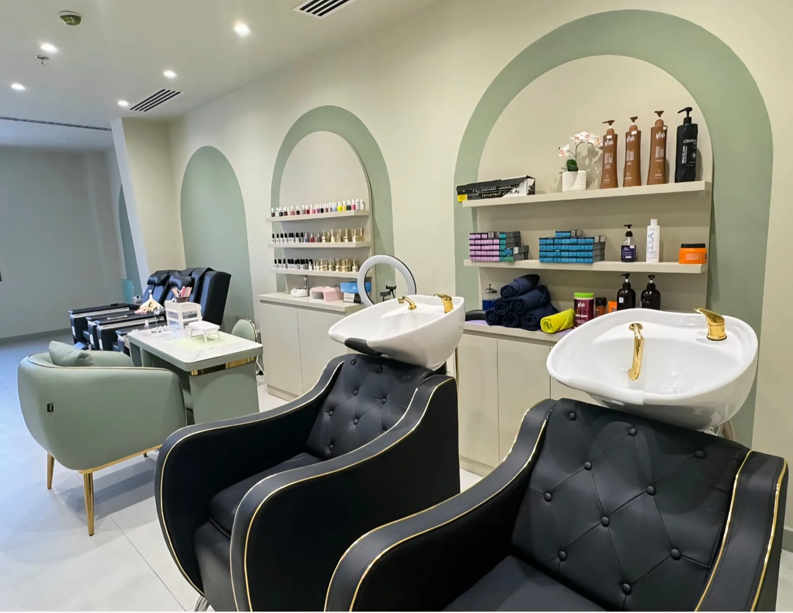 Sage arches, wash stations and nail area inside Zaaya Beauty Salon
