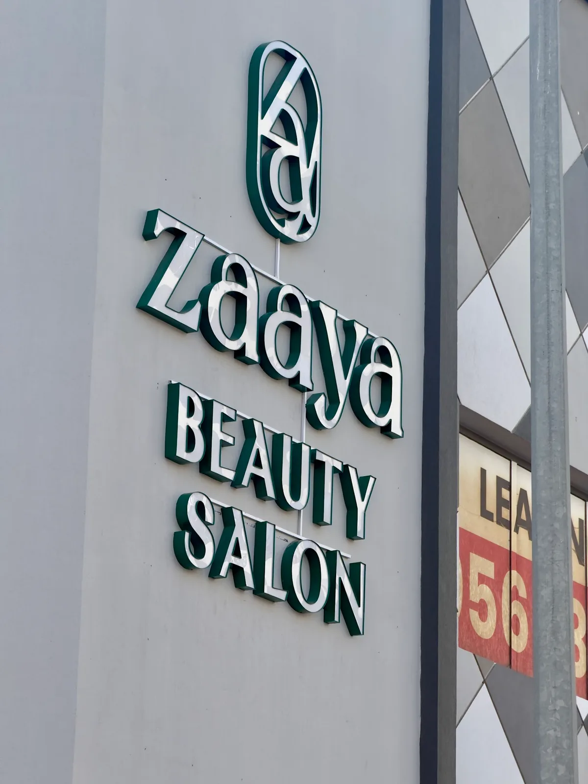 Zaaya Beauty Salon green-and-cream exterior sign