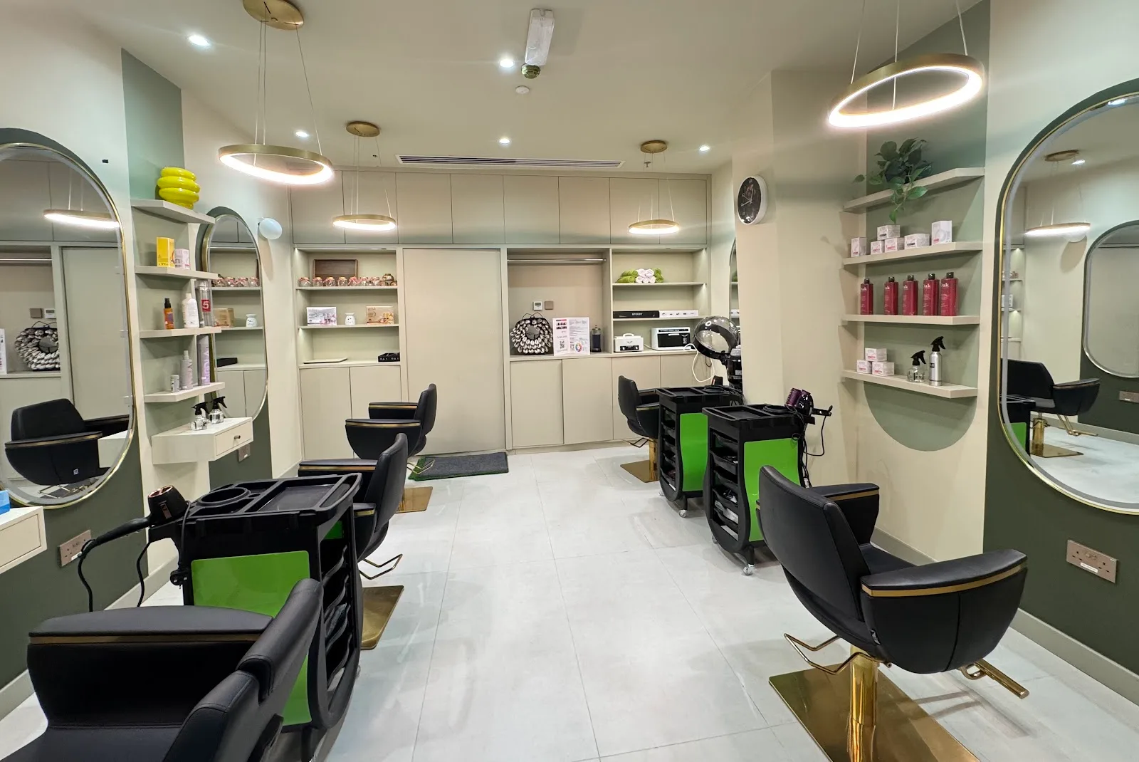 Wide view of hair styling area with gold ring lights