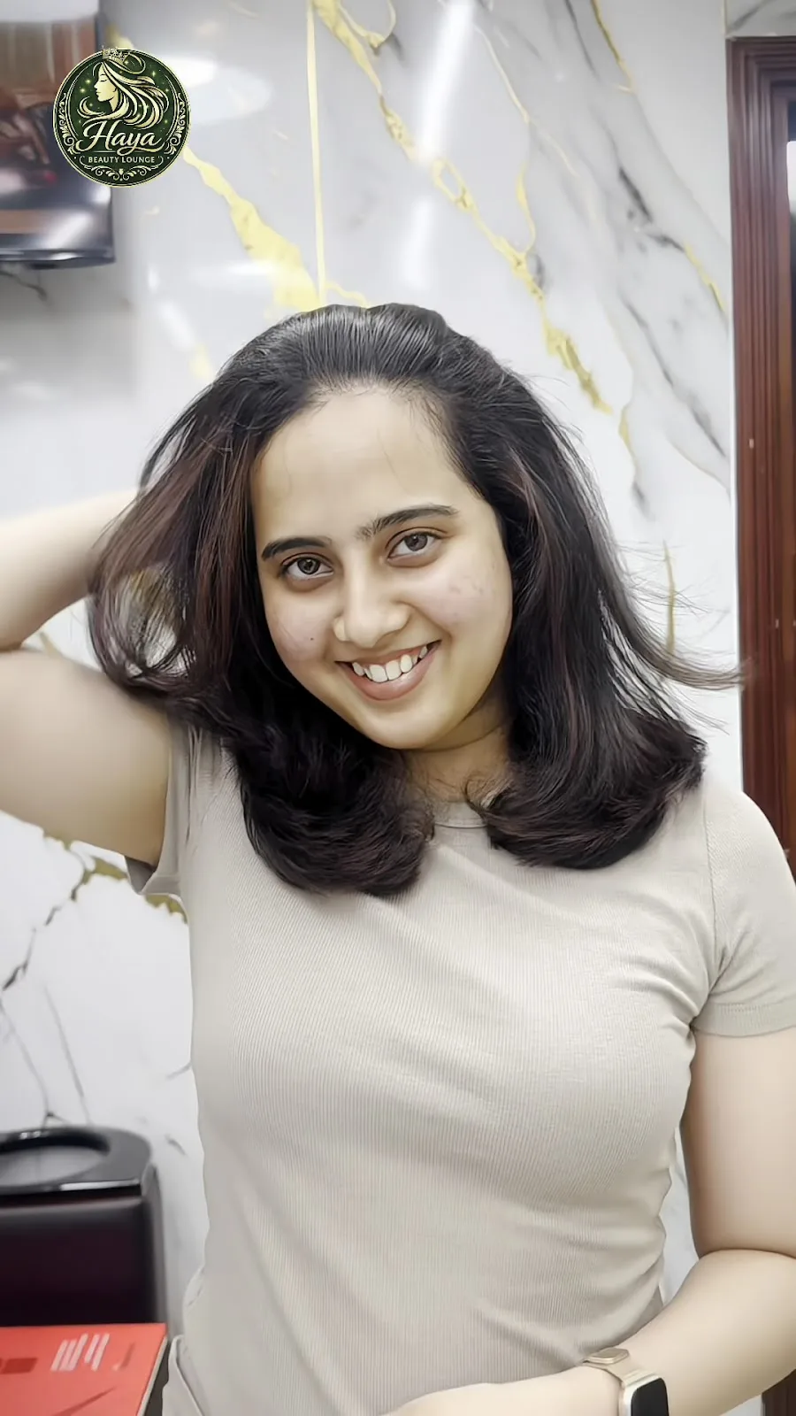 Happy client with a fresh hairstyle at the lounge