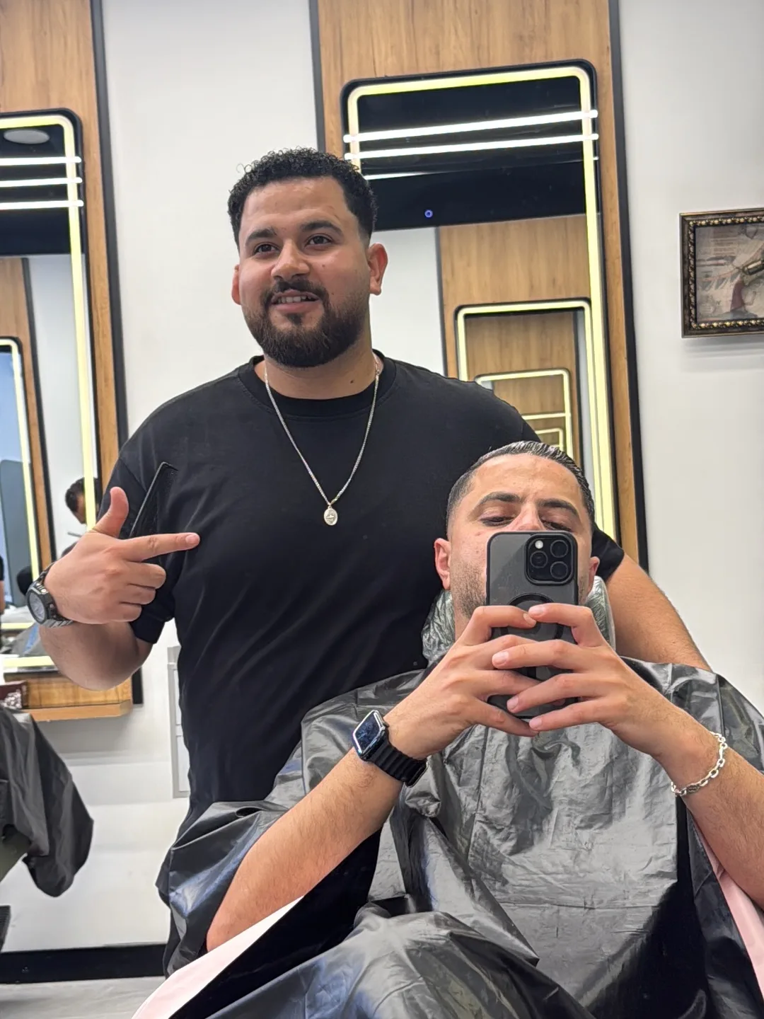 A BOYKA barber finishing a client's cut