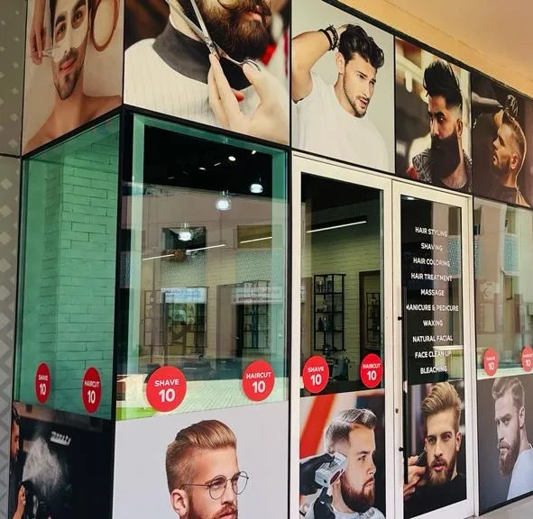 H&B Gents Salon storefront window with style photography
