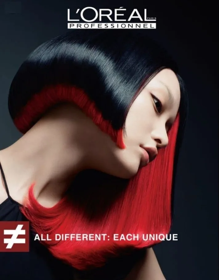A bold red and black colour transformation showing the kind of professional hair colour offered at the salon