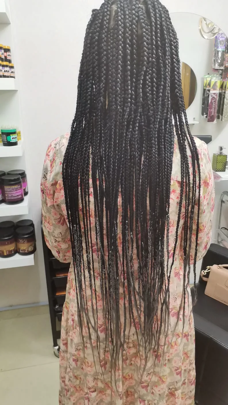 Long box braids styled at Bella22