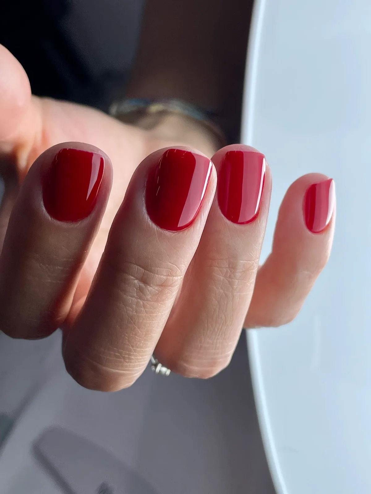 Glossy deep-red gel manicure