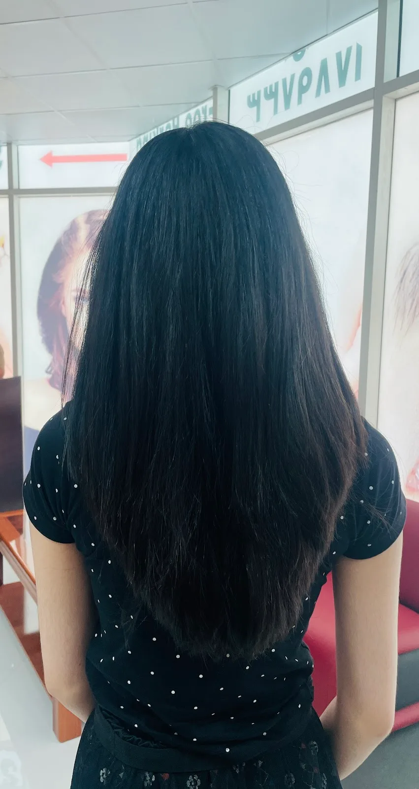 Long black hair with healthy shine after a salon visit