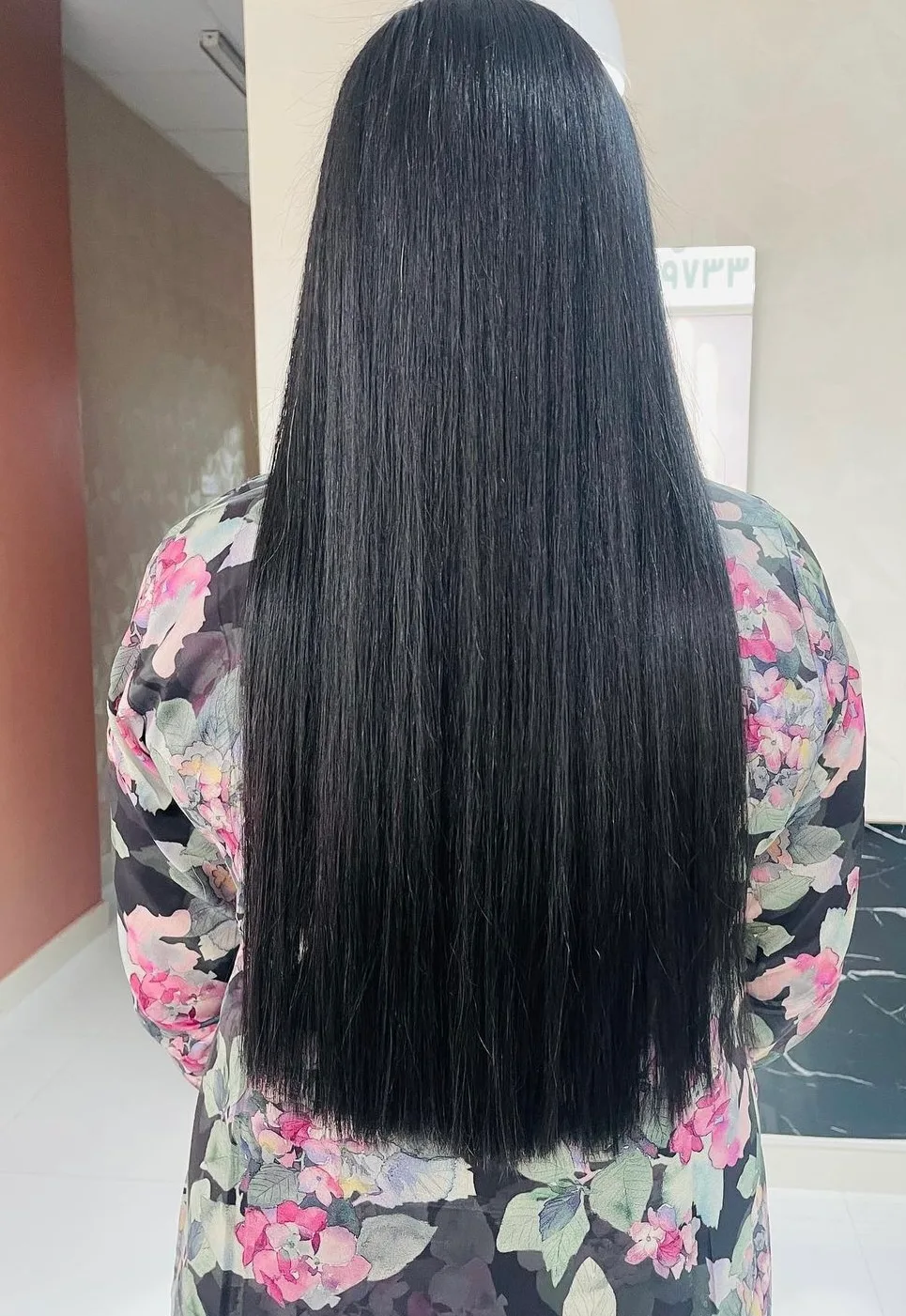 Very long, sleek straight black hair after styling