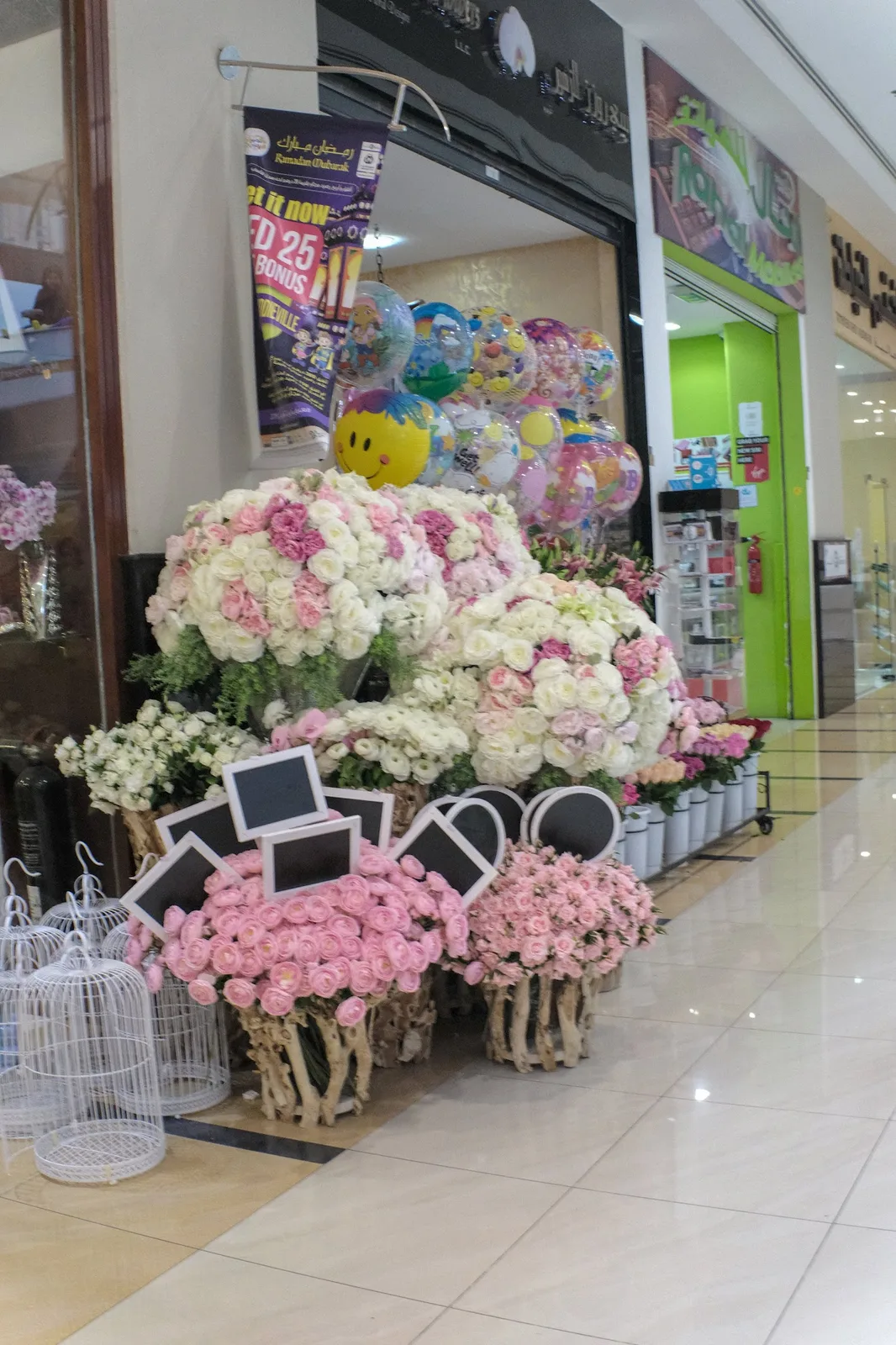 Large pink and white floral display at the shopfront