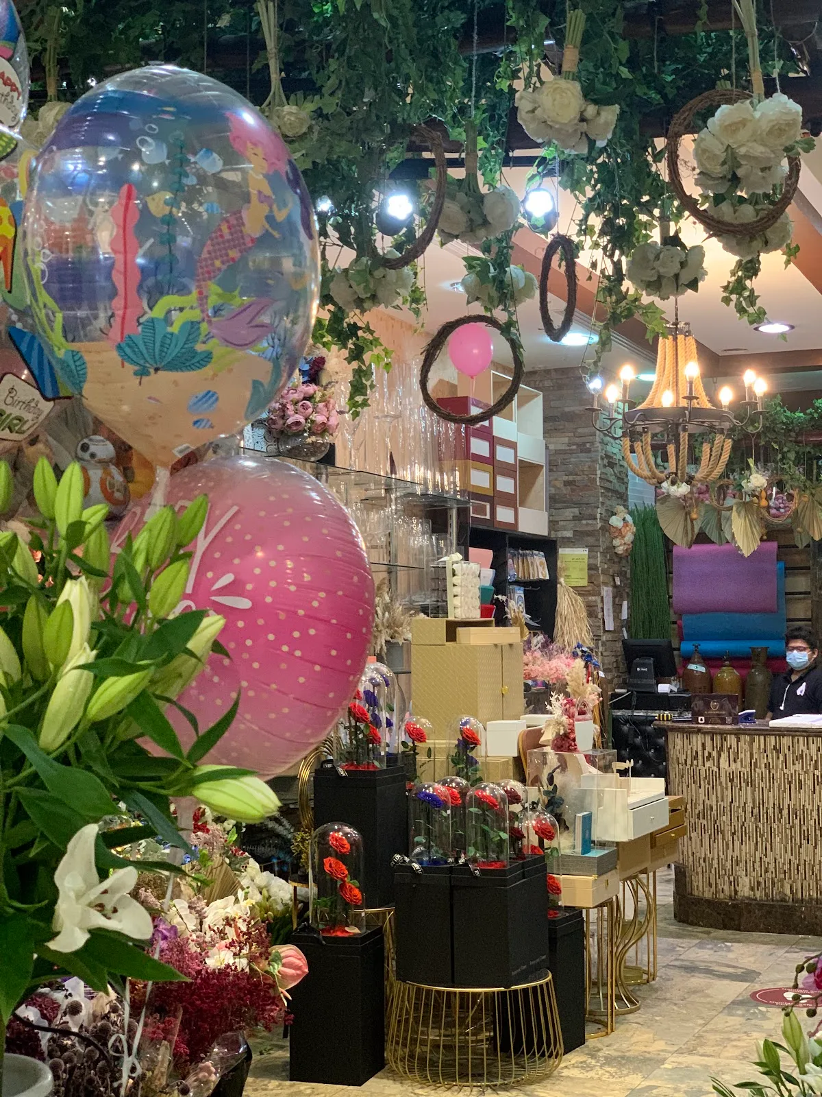 Balloons and flowers displayed inside Baby Rose Flower Shop