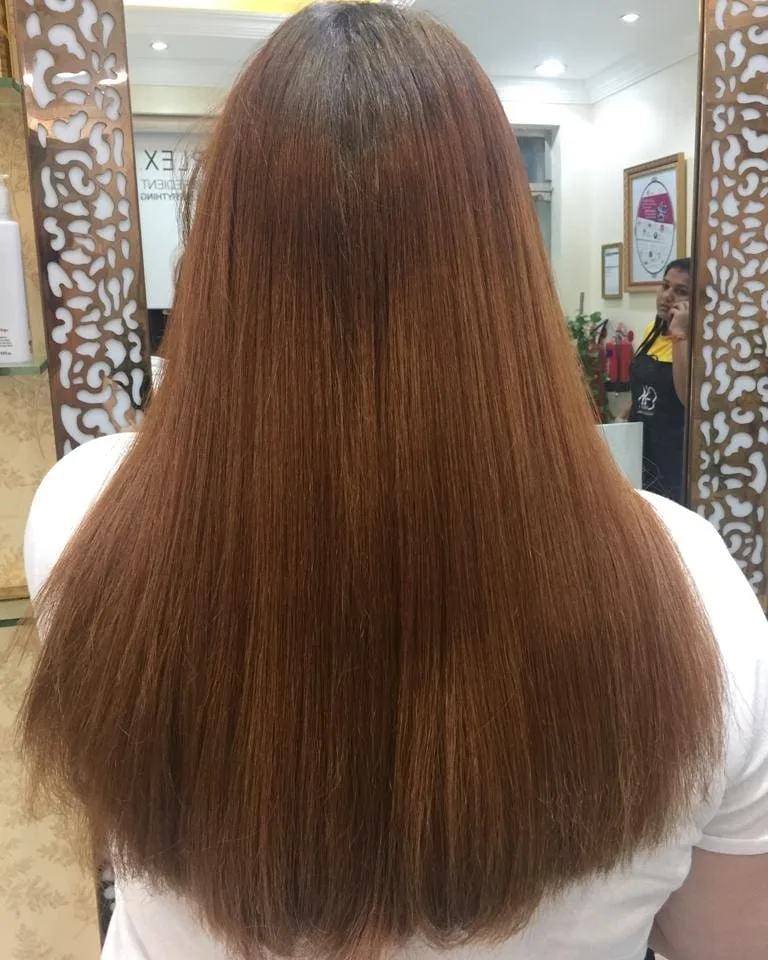 Rich auburn hair colour result from the salon