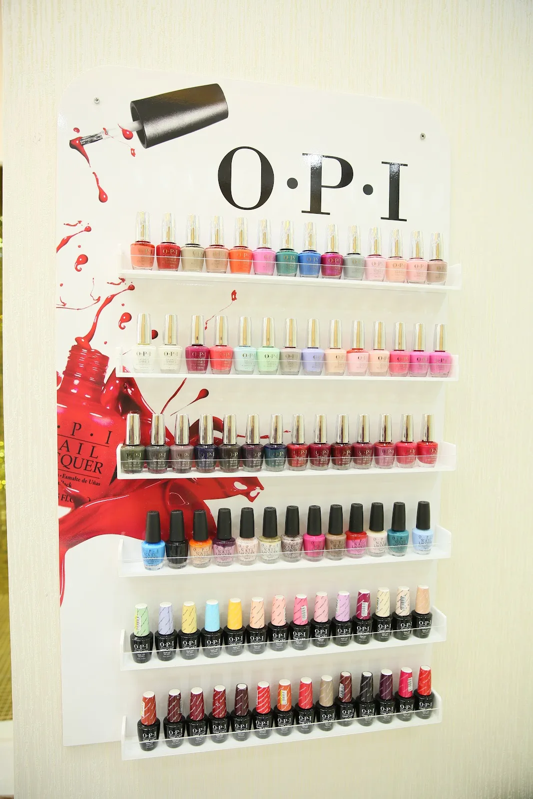 Wall display of professional nail lacquers in the salon